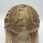 Blonde lace front wig with cap construction and adjustable straps.